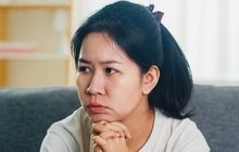 ressed-crying-asian-woman-stressed-with-headache-sitting-sofa-living-room-house7861-2455-17818...jpg
